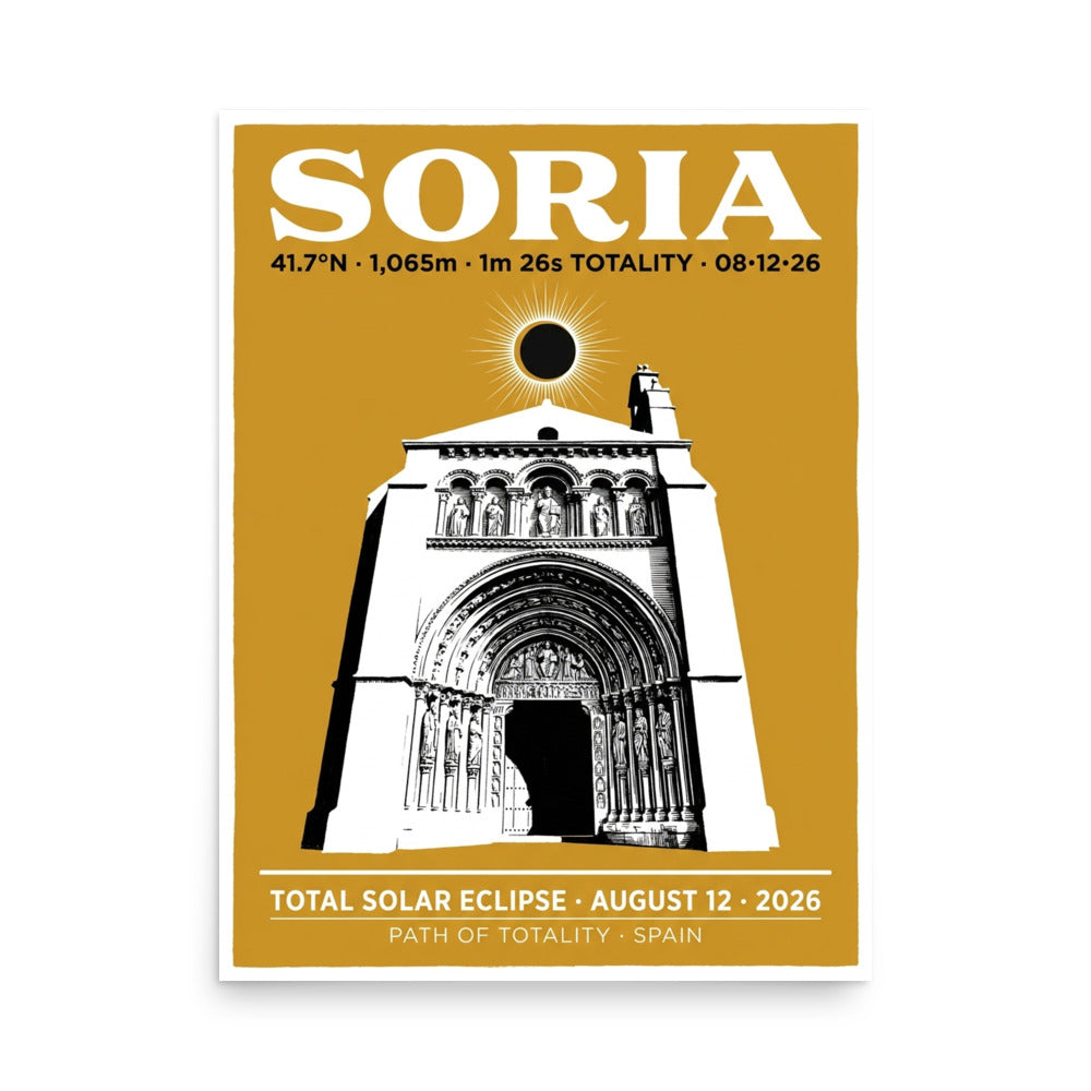Framed 18x24 Soria Eclipse 2026 poster hanging on a white wall, showing a warm gold background with white silhouette of the Iglesia de Santo Domingo portal and a black eclipse disc with white corona above it