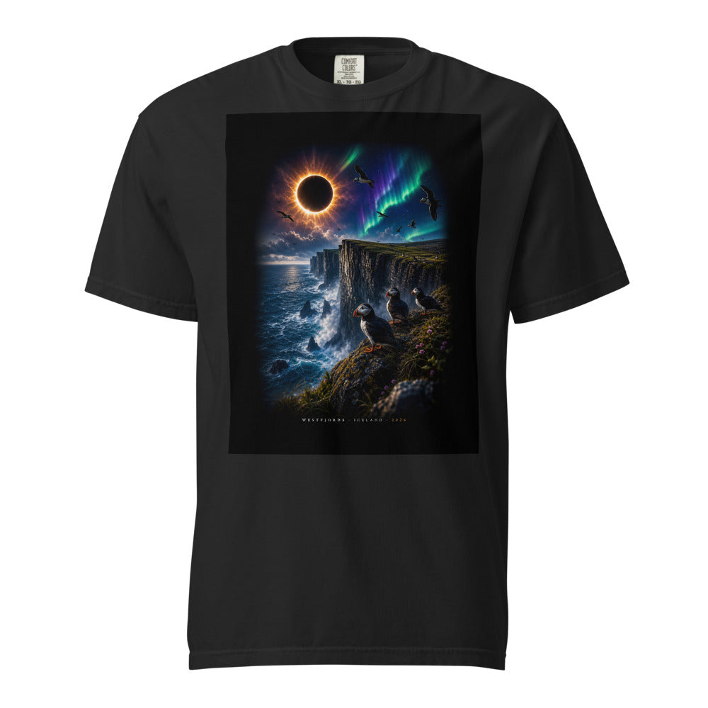Black unisex t-shirt for the Iceland solar eclipse 2026, featuring Westfjords Látrabjarg cliffs totality design, shown flat lay on dark surface